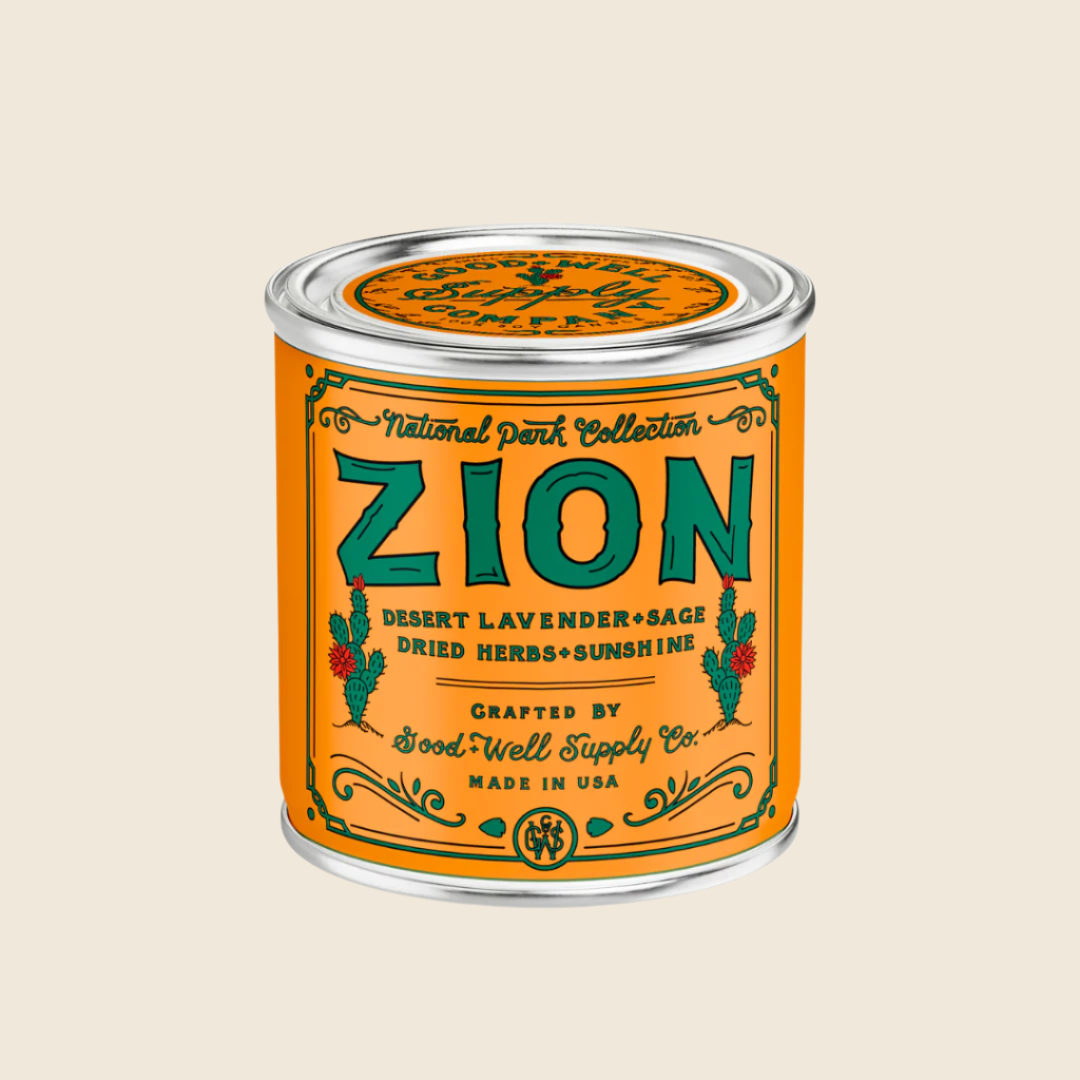 Zion candle in a tin with an orange label on a white background