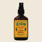 Bottle of Zion Cabin Spray with a yellow label 